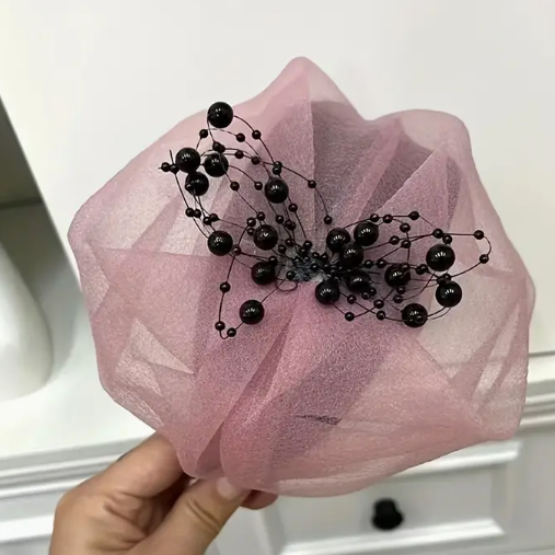 Purple people fascinator